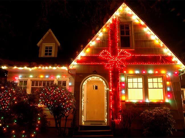 A home decorated with hundreds of Christmas lights