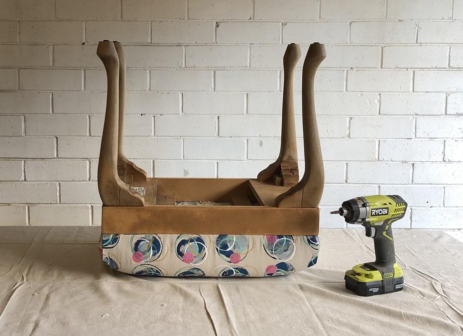 The madeover footstall overturned with a Ryobi drill driver sitting next to it on the table