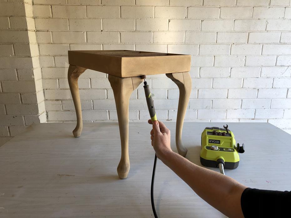 Use a Ryobi rotary tool to sand joints of footstall