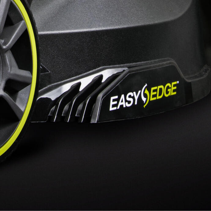 Close up of a RYOBI lawn mower wheel and side