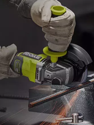 Person using RYOBI angle grinder to cut thin metal rod with sparks flying