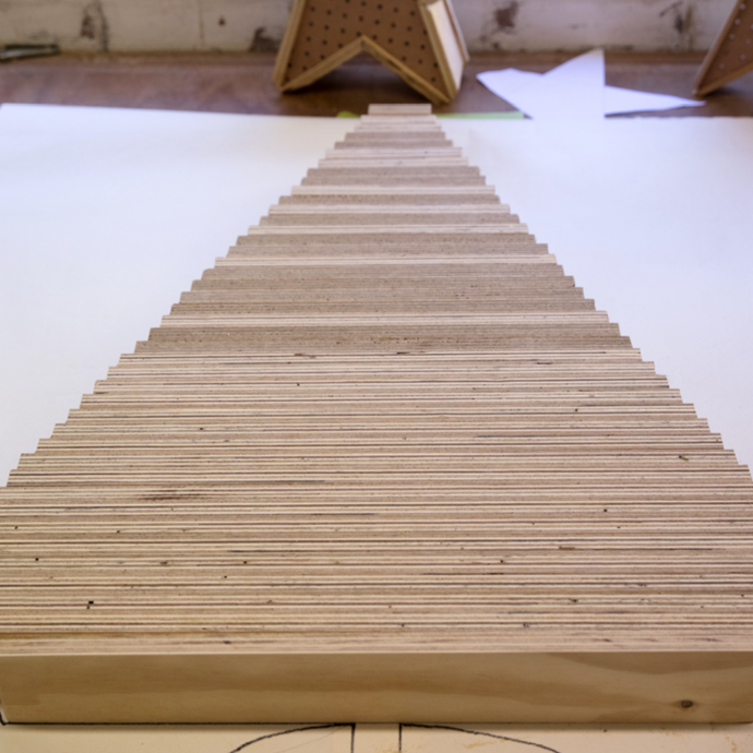 Wooden planks lined up to shape the Christmas tree